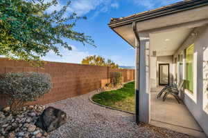 Fenced backyard featuring a patio area