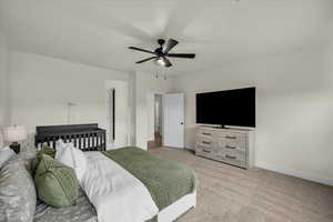Bedroom featuring light carpet and ceiling fan