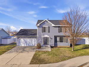 View of front of property featuring roof with shingles, driveway, and an attached garage
