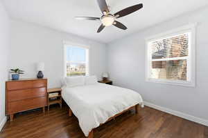 Bedroom featuring dark wood finished floors and a ceiling fan
