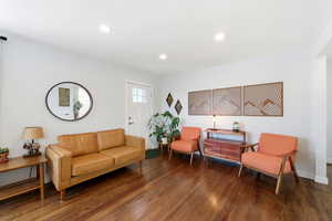 Living area with recessed lighting and wood finished floors