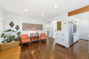 Sitting room featuring dark wood-style flooring and recessed lighting