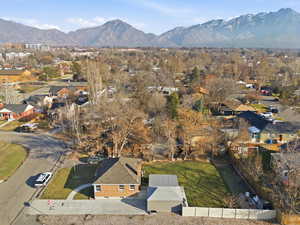 Aerial overview of property's location featuring nearby suburban area and mountains