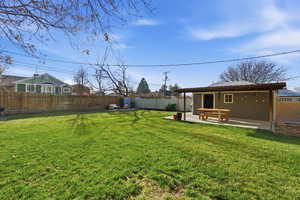 Fenced backyard featuring a patio area