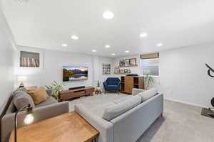 Living room featuring carpet and recessed lighting