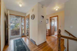 Foyer entrance with hardwood floors