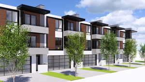 View of building exterior with driveway and a garage