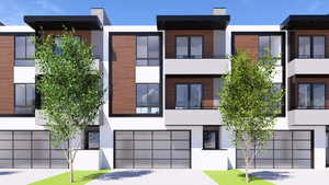 View of building exterior featuring driveway and a garage