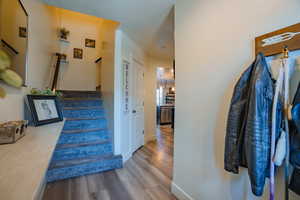 Stairs featuring baseboards and wood finished floors
