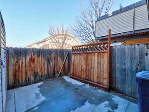 Fenced backyard featuring a patio