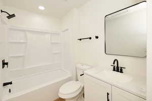 Full bath with vanity, shower / washtub combination, and recessed lighting