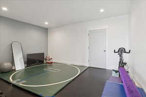 Interior space with recessed lighting, basketball court, and finished concrete floors