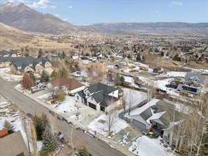 Snowy aerial view with a residential view and a mountain view