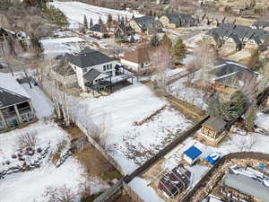 Snowy aerial view with a residential view