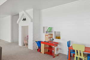Playroom featuring carpet flooring and a textured ceiling
