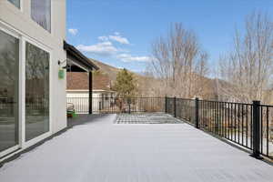 View of patio with a deck with mountain view