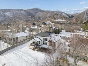 Snowy aerial view featuring a mountain view