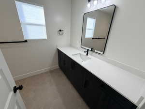 Bathroom with vanity and light tile patterned floors