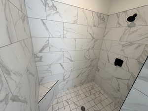Bathroom featuring a tile shower
