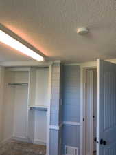 Built-in closet system with hanging rods and shelving