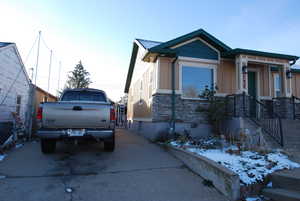 View of front of property with stone siding and board and batten siding