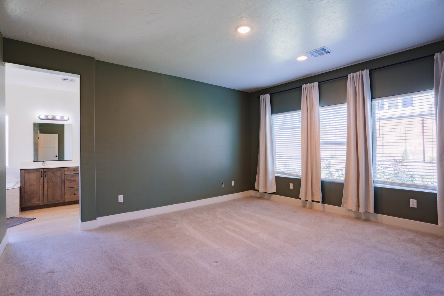 Unfurnished room featuring light colored carpet and recessed lighting
