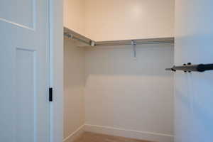 Spacious closet with carpet