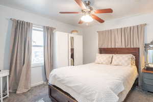 Bedroom with carpet and a ceiling fan