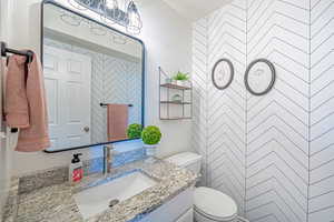 Bathroom with vanity and toilet