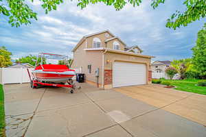 View of RV Pad, extra wide! Has room to extend into backyard easily. Additional garage could be built in backyard!