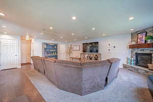 Living area with recessed lighting and a fireplace