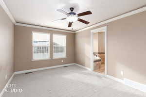 Primary bedroom featuring crown molding, with LED lighting, a ceiling fan, and light carpet
