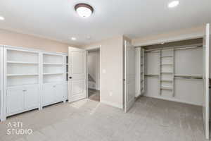 Bedroom 5 or office featuring light colored carpet, recessed lighting, and a closet