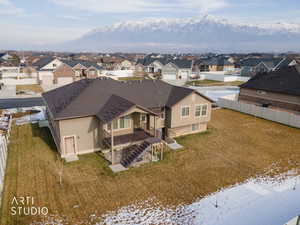 Aerial perspective of suburban area featuring a mountain backdrop