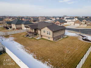 Snowy aerial view with a residential view