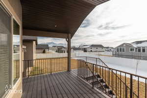 Deck with a residential view and a fenced backyard