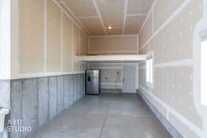 Extra tall and deep garage with storage loft.  Door exits to backyard.