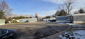 View of asphalt street featuring a mountain view