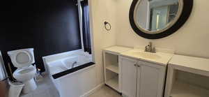 Full bathroom featuring vanity, a bath, and light tile patterned floors