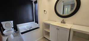 Full bathroom with vanity, a garden tub, and light tile patterned floors