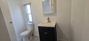 Bathroom with vanity and toilet