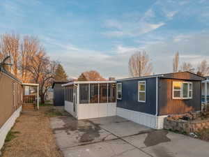 View of front of property featuring a sunroom