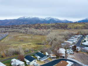 Aerial perspective of suburban area with a mountainous background