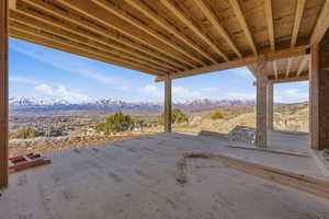 Main level covered deck featuring outdoor fireplace