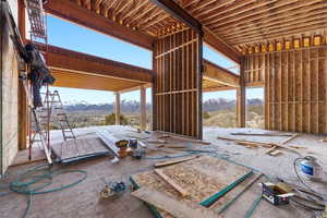 Main living room with multiple windows and doors