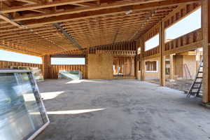 View of 5 car garage with large ceilings and lots of windows