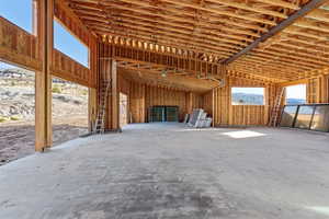 View of 5 car garage with large ceilings and lots of windows