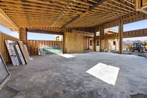 View of 5 car garage with large ceilings and lots of windows
