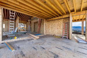 Main level covered deck featuring outdoor fireplace