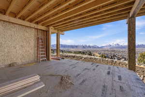 Main level covered deck featuring outdoor fireplace